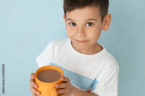 Cute little boy with cup of...
