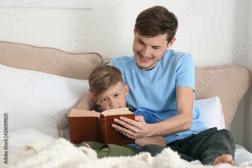 Father and his son reading ...