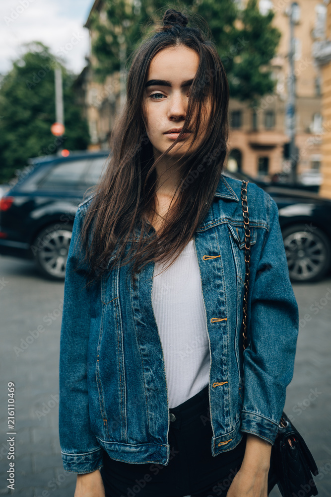 Portrait of attractive girl in summer city