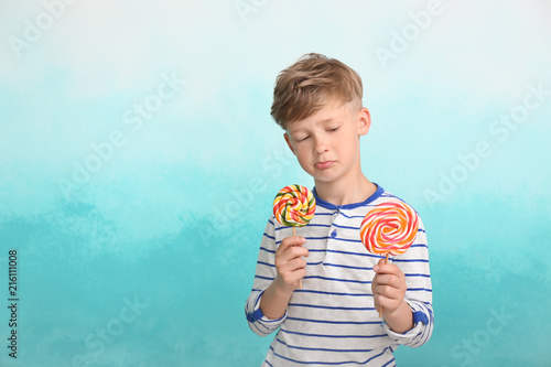 Cute little boy with lollip...