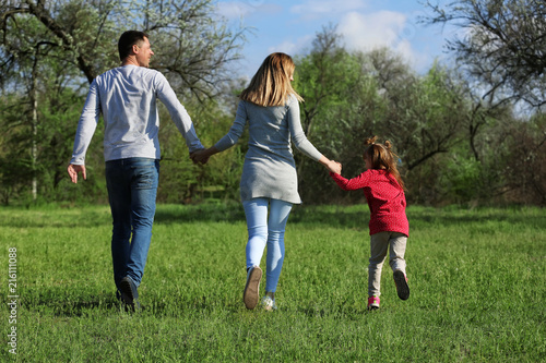 Happy family in park on sunny day