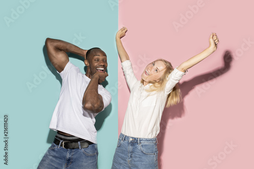 The squint eyed couple with weird expression on blue and pink studio
