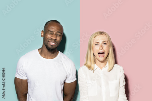 Man and woman posing at studio during quarrel