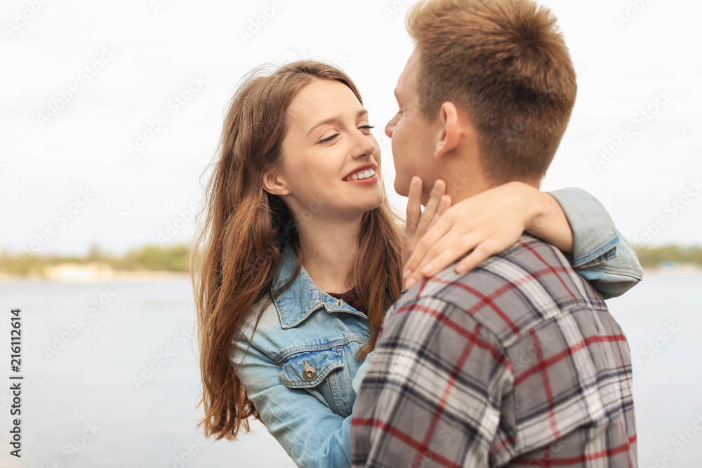 Happy young couple near river on spring day Happy young couple near river on spring day