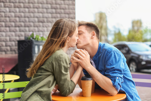 Happy young couple kissing ...