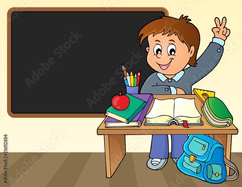 Boy behind school desk theme image 2