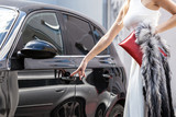 Fashionable woman opening car