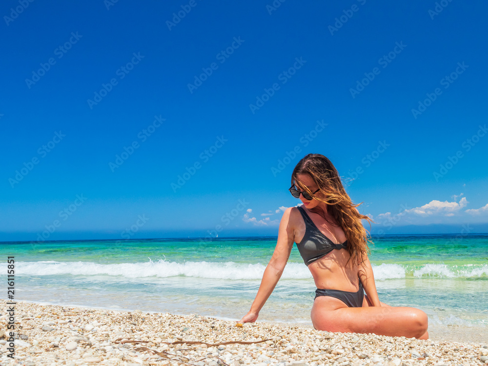 woman sunbathing on the beach