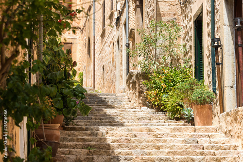 Mediterranean alley in Spain with ancient houses and idyllic atmosphere © abasler