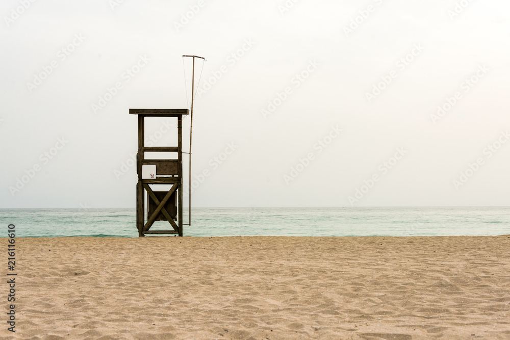 Abandoned lifeguard tower platform at beach as background Abandoned lifeguard tower platform at beach as background