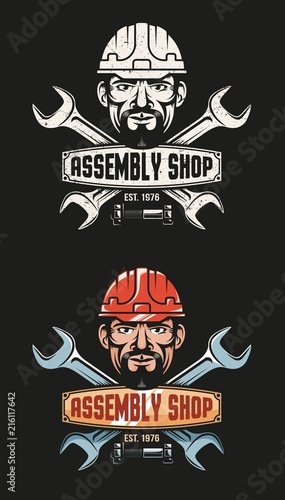  Vintage emblem of the workshop - crossed wrenches and a worker's head in a hardhat. Grunge texture on a separate layer