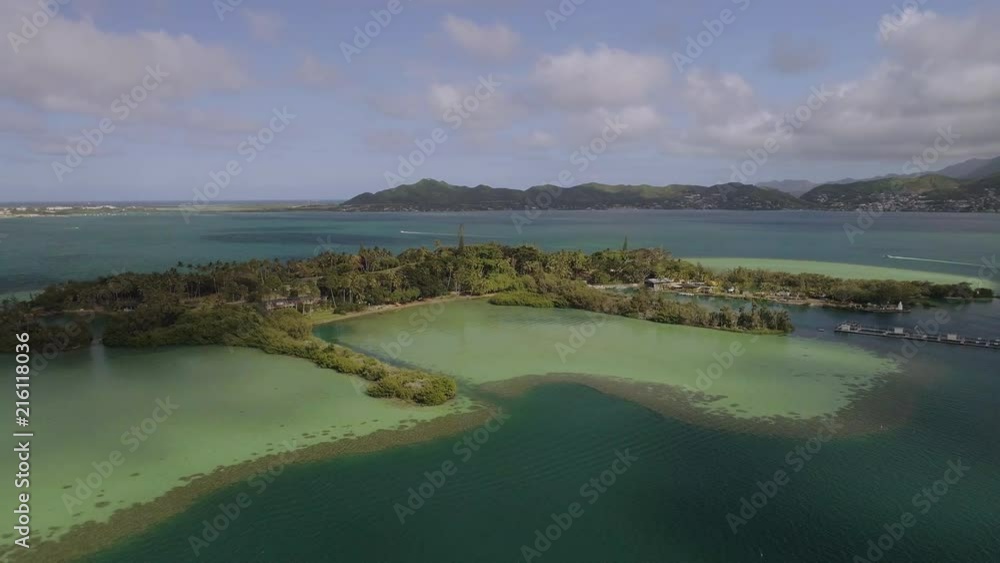 An aerial shot of an island in the middle of the ocean. An aerial shot of an island in the middle of the ocean.