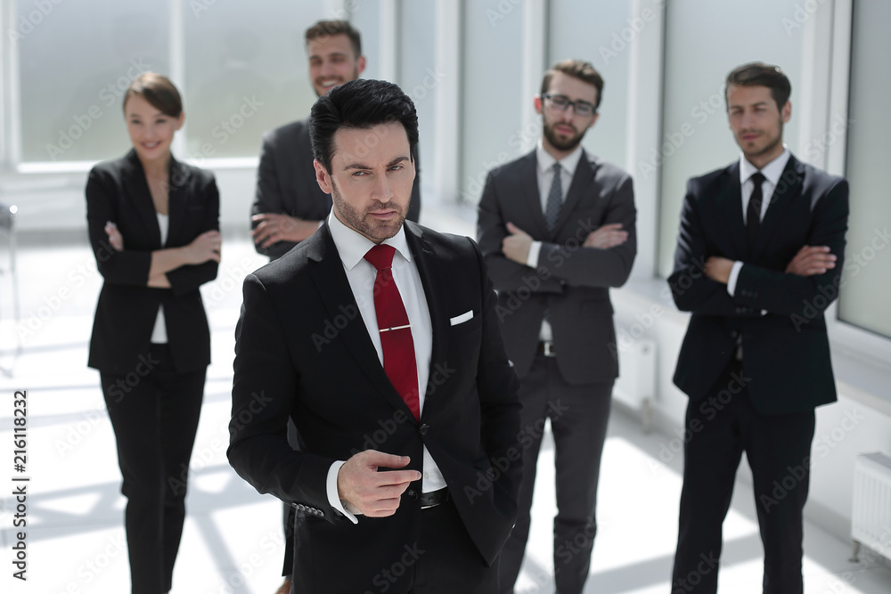 serious businessman standing in the office serious businessman standing in the office