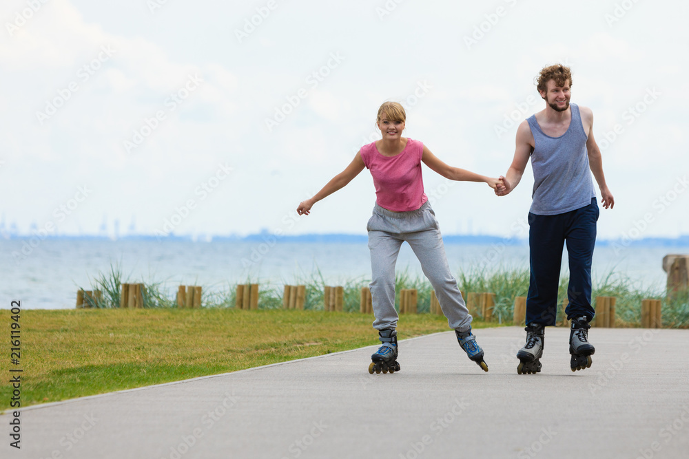 Fototapeta premium roller skater couple skating outdoor