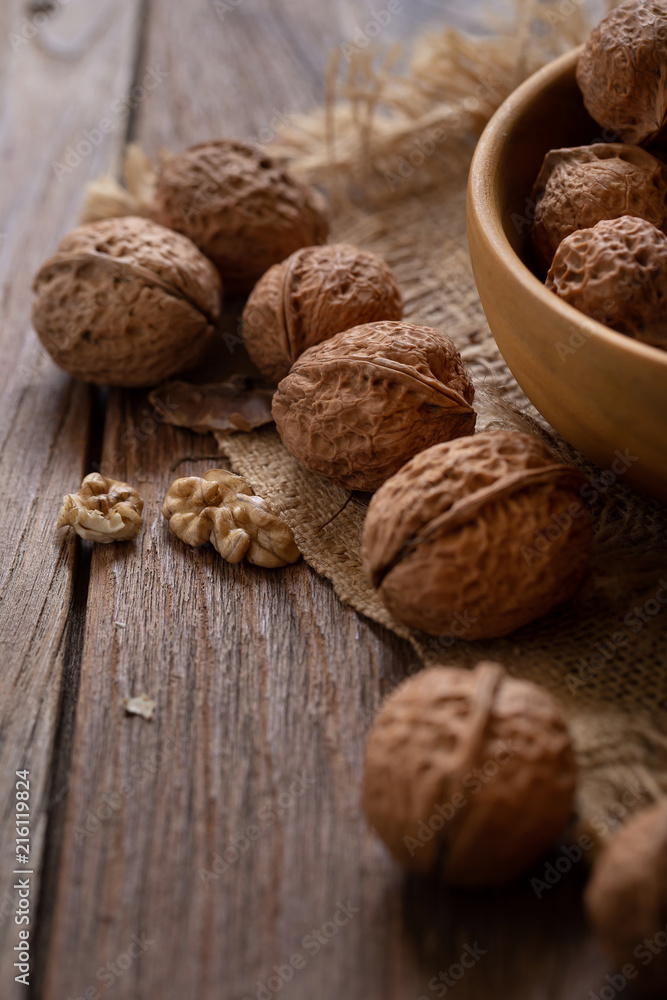 Walnuts kernels in wooden bowl, Walnut healthy food Top view Walnuts kernels in wooden bowl, Walnut healthy food Top view