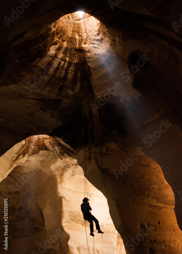 Silhouette of training alpinist in Luzit caves. Moshav Luzit, Ella Valley. Israel photo