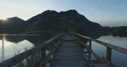 Wallpaper Mural POV point of view walking along bridge wood path on lake at sunrise in summer. Europe outdoor green nature scape wild establisher.4k establishing shot Torontodigital.ca