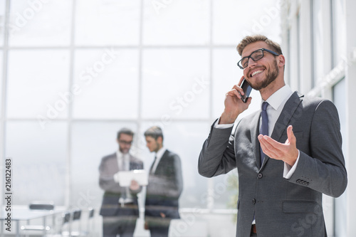 happy businessman talking on mobile