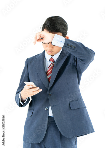 Businessman in suit holding smartphone