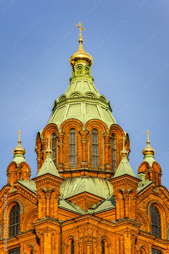 Uspenski cathedral (Uspenskin katedraali, 1862 - 1868), dedicated to Dormition of Theotokos (Virgin Mary). Sunset. Helsinki, Finland.