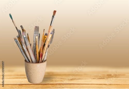 Brushes in a glass jar