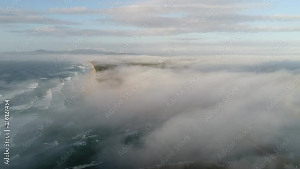 Hovering above low clouds and fog covering Nambucca Heads town and delta of Nambucca river at the entrance to Pacific ocean.
Hovering above low clouds and fog covering Nambucca Heads town and delta of Nambucca river at the entrance to Pacific ocean.