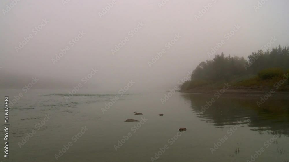 Looking east down the North Saskatchewan River on a foggy autumn morning. Edmonton, Canada. Looking east down the North Saskatchewan River on a foggy autumn morning. Edmonton, Canada.