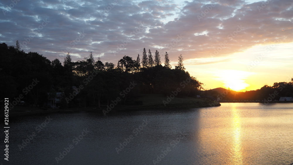 Fototapeta premium Sunrise over the lake in the forest.