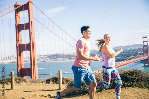 Couple running in San Francisco © oneinchpunch