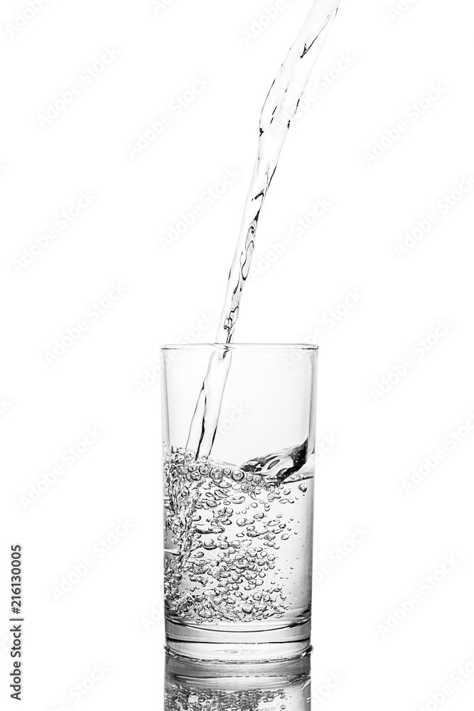 Water poured in glass transparent white background Water poured in glass transparent white background