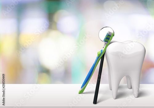Big tooth and dentist mirror © BillionPhotos.com