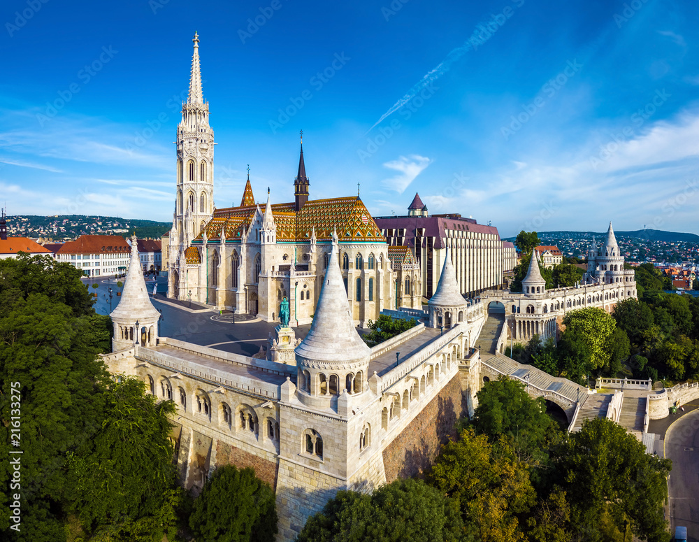 Budapest, Hungary - Aerial view of famous Fisherman's Bastion (Halaszbastya) and Matthias Church (Matyas templom) in the summer morning with Buda Hills at background