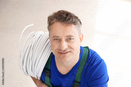 Mature electrician with wir...