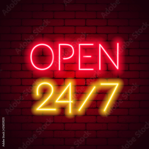 Neon sign 24 7 on brick wall background.