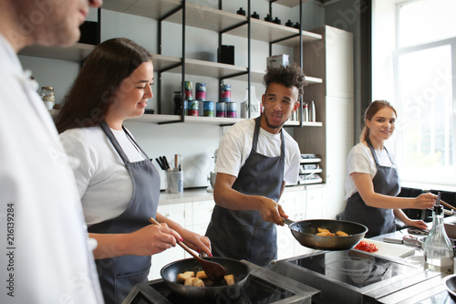 Young people during cooking...