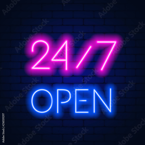 Neon sign 24 7 on brick wall background.