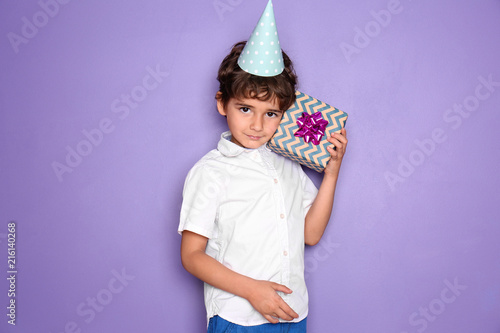 Cute little boy with gift f...