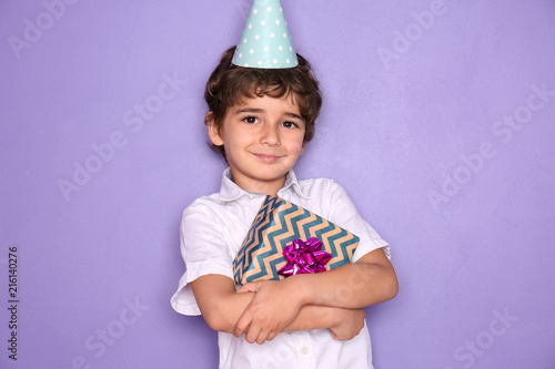 Cute little boy with gift f...