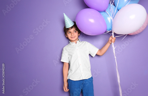 Cute little boy with balloo...