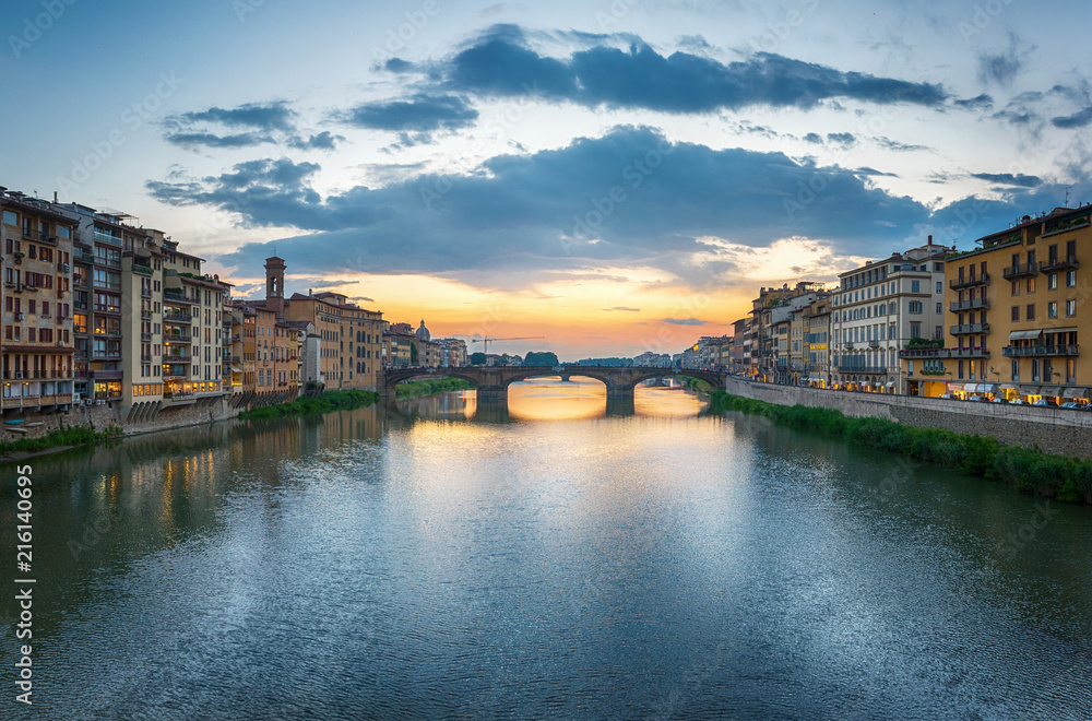 View of the Arno river, evening Florence and the St Trinity Bridge. Florence, Italy.