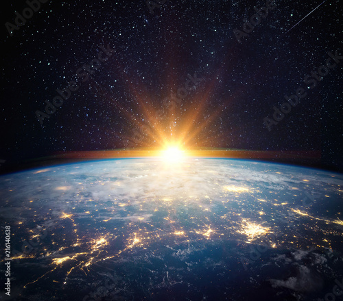 Fototapeta Naklejka Na Ścianę i Meble -  Earth, sun, star and galaxy. Sunrise over planet Earth, view from space. Elements of this image furnished by NASA