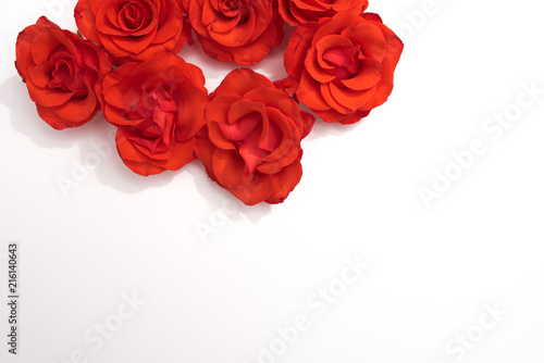 Floral pattern made of red roses on white background. Flat lay  top view. Valentine s background