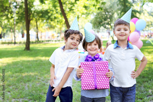 Cute little boy with gift b...