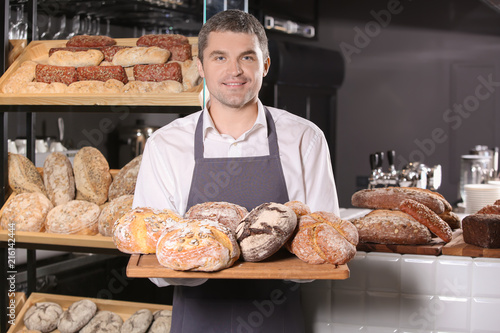 Man holding board with asso...