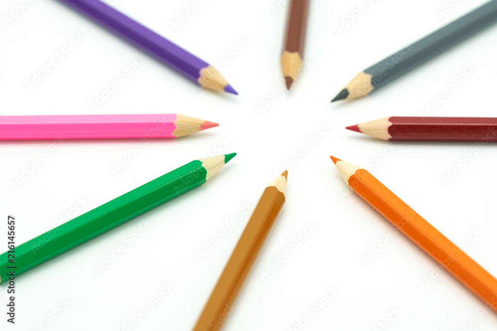Colorful wooden pencils surround a circle on a white background. Make a center Can be used as background or fill in text with copy spaces. Colorful wooden pencils surround a circle on a white background. Make a center Can be used as background or fill in text with copy spaces.