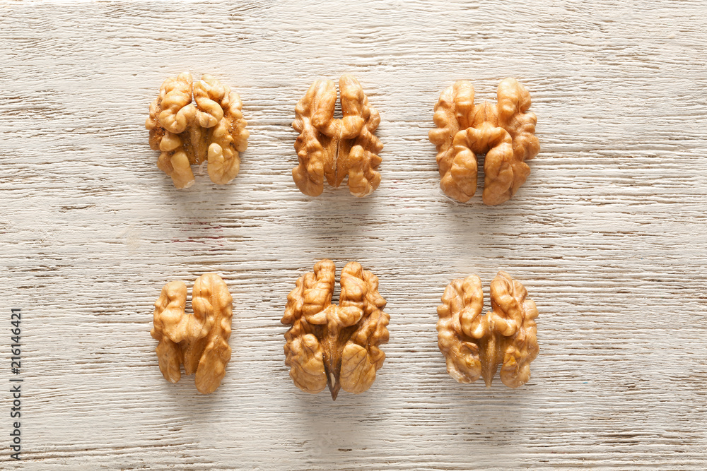 Fototapeta premium Tasty walnuts on wooden background