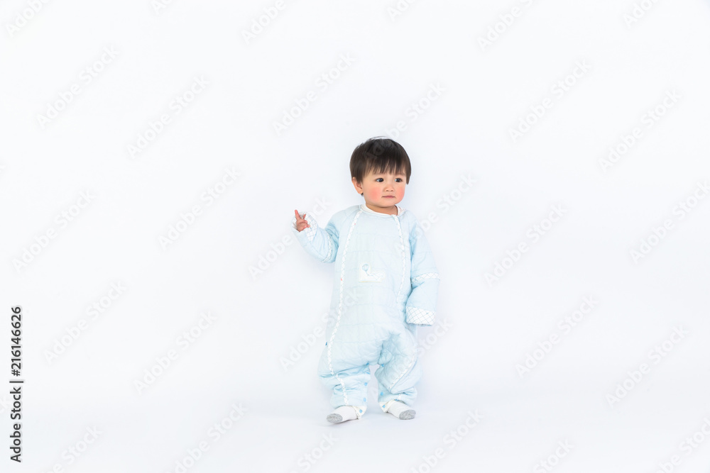 Infant child baby girl kid toddler in diaper make first steps isolated on a white background Infant child baby girl kid toddler in diaper make first steps isolated on a white background
