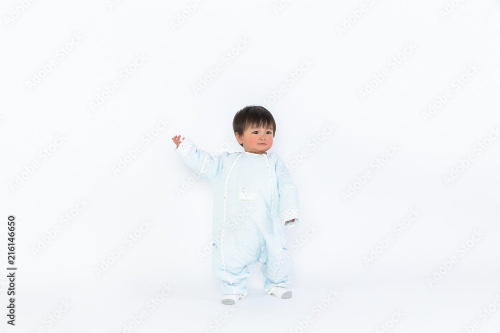 Infant child baby girl kid toddler in diaper make first steps isolated on a white background Infant child baby girl kid toddler in diaper make first steps isolated on a white background