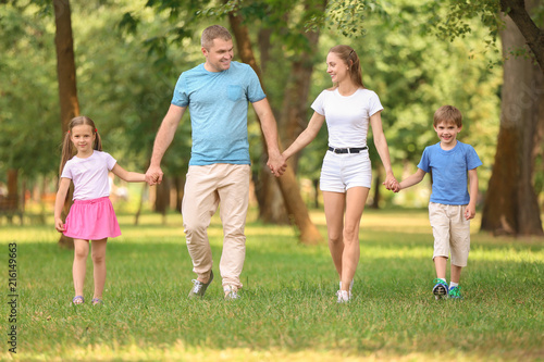 Happy family walking togeth...