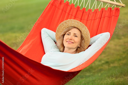 Mature woman resting in ham...